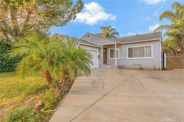 19119 Lemay St, Reseda, CA 91335 - view of front of home featuring stucco siding, a garage, and concrete driveway