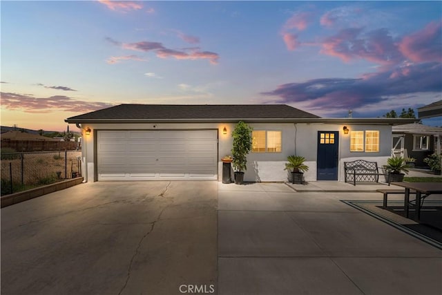 42545 30th St W, Lancaster, CA 93536 - ranch-style home with stucco siding, concrete driveway, and an attached garage