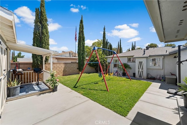 42545 30th St W, Lancaster, CA 93536 - fenced backyard featuring a playground and a patio area