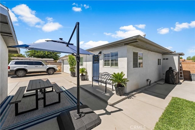 42545 30th St W, Lancaster, CA 93536 - view of patio / terrace with a garage and concrete driveway