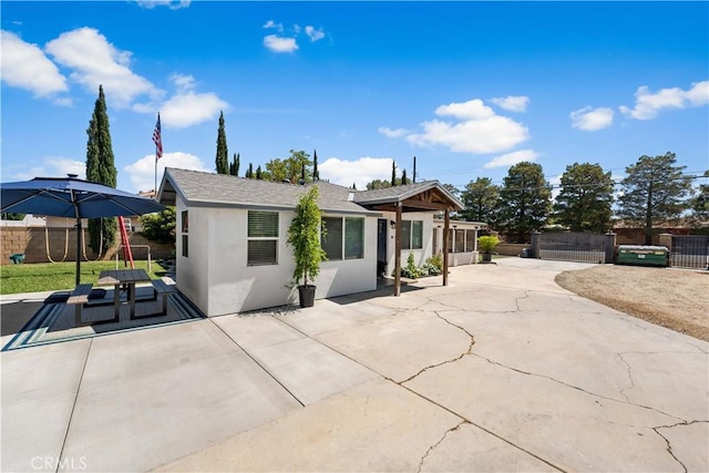 42545 30th St W, Lancaster, CA 93536 - view of front facade with stucco siding and a patio