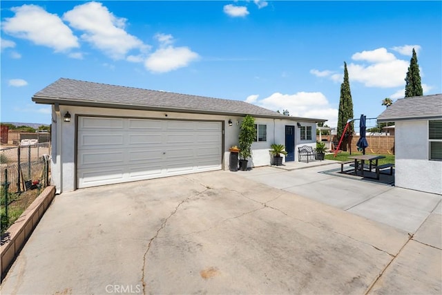 42545 30th St W, Lancaster, CA 93536 - view of front facade featuring stucco siding, concrete driveway, and an attached garage