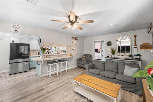 42545 30th St W, Lancaster, CA 93536 - living area featuring a ceiling fan and light wood-style floors