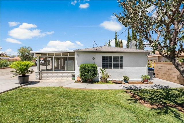 42545 30th St W, Lancaster, CA 93536 - rear view of property with a sunroom, stucco siding, and a chimney