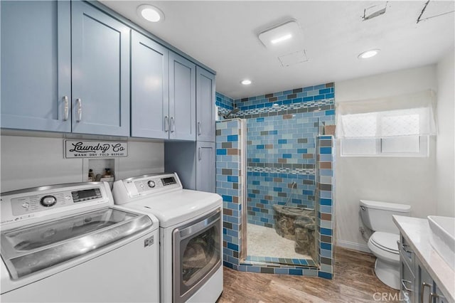 42545 30th St W, Lancaster, CA 93536 - washroom featuring washer and clothes dryer, wood finished floors, and recessed lighting