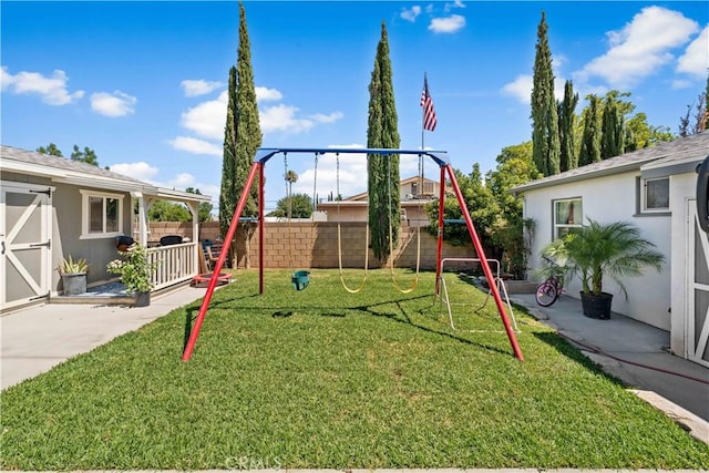 42545 30th St W, Lancaster, CA 93536 - view of jungle gym featuring a fenced backyard and a patio area