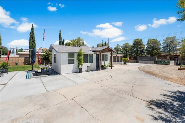 42545 30th St W, Lancaster, CA 93536 - view of front of property with stucco siding and a patio area