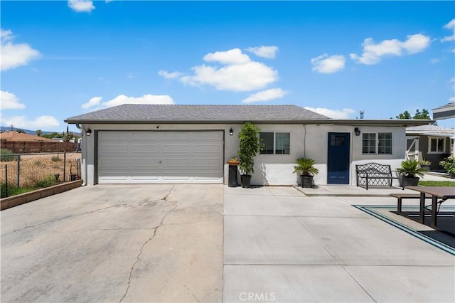 42545 30th St W, Lancaster, CA 93536 - ranch-style house featuring stucco siding, an attached garage, and concrete driveway