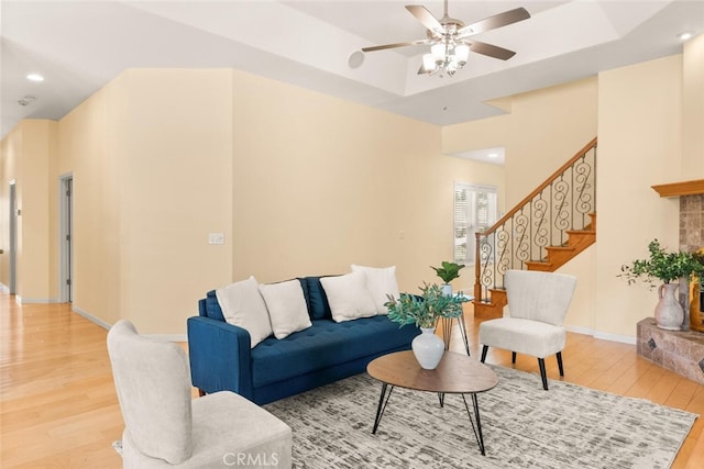 13962 Lindbergh Cir, Chico, CA 95973 - living area with light wood-type flooring, a ceiling fan, stairs, recessed lighting, and a raised ceiling