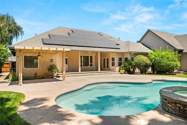 13962 Lindbergh Cir, Chico, CA 95973 - rear view of property featuring a ceiling fan, solar panels, a patio, and stucco siding