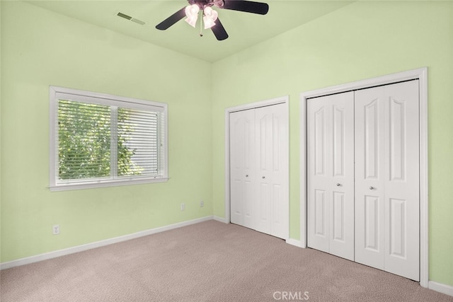 13962 Lindbergh Cir, Chico, CA 95973 - unfurnished bedroom with carpet flooring, two closets, and ceiling fan