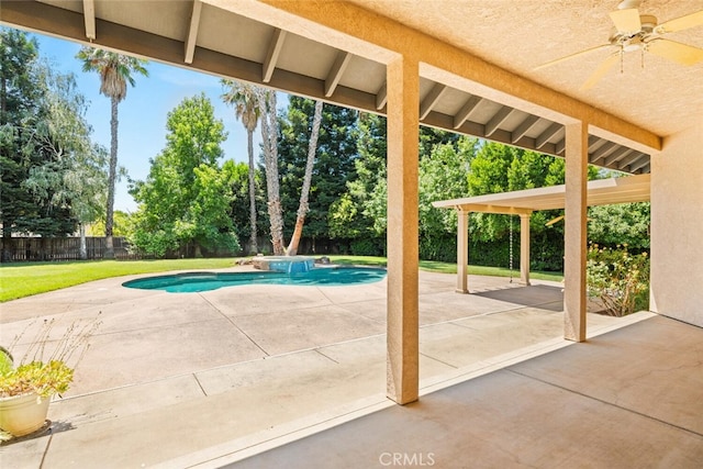 13962 Lindbergh Cir, Chico, CA 95973 - view of pool featuring a ceiling fan, a fenced backyard, a patio area, and view of wooded area