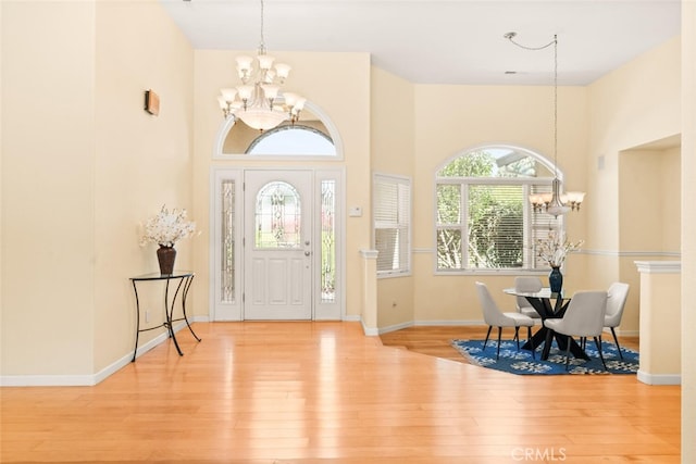 13962 Lindbergh Cir, Chico, CA 95973 - foyer entrance featuring a chandelier, wood finished floors, healthy amount of natural light, and a towering ceiling