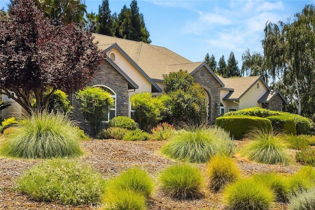 13962 Lindbergh Cir, Chico, CA 95973 - view of side of property with stone siding and stucco siding