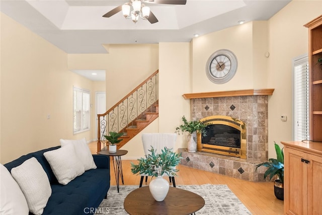 13962 Lindbergh Cir, Chico, CA 95973 - living room featuring wood finished floors, stairway, ceiling fan, a fireplace, and recessed lighting