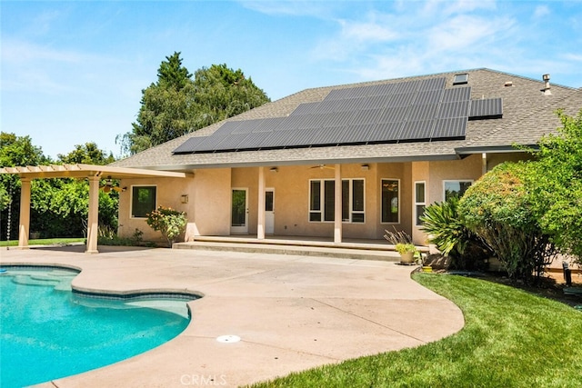 13962 Lindbergh Cir, Chico, CA 95973 - back of house featuring a patio area, a shingled roof, and solar panels