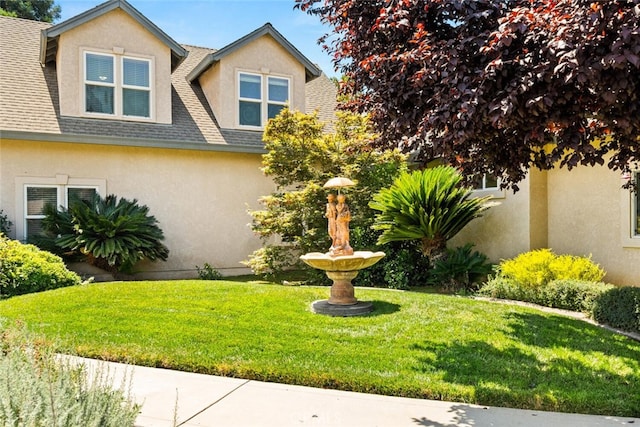 13962 Lindbergh Cir, Chico, CA 95973 - view of front of home featuring stucco siding, roof with shingles, and a front lawn