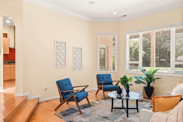 13962 Lindbergh Cir, Chico, CA 95973 - sitting room with arched walkways, light wood-style floors, ornamental molding, and recessed lighting