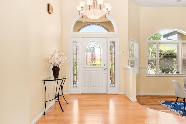 13962 Lindbergh Cir, Chico, CA 95973 - foyer entrance featuring a chandelier, wood-type flooring, and a towering ceiling