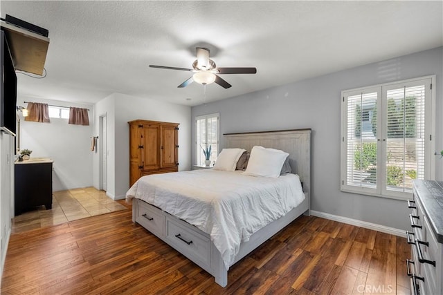 21643 Masterson Ct, Saugus, CA 91350 - bedroom with dark wood-style floors, multiple windows, and ceiling fan