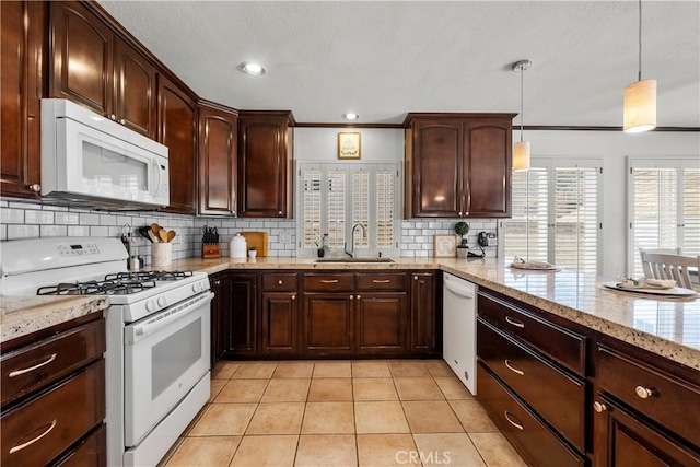 21643 Masterson Ct, Saugus, CA 91350 - kitchen featuring white appliances, backsplash, light stone counters, light tile patterned floors, and decorative light fixtures
