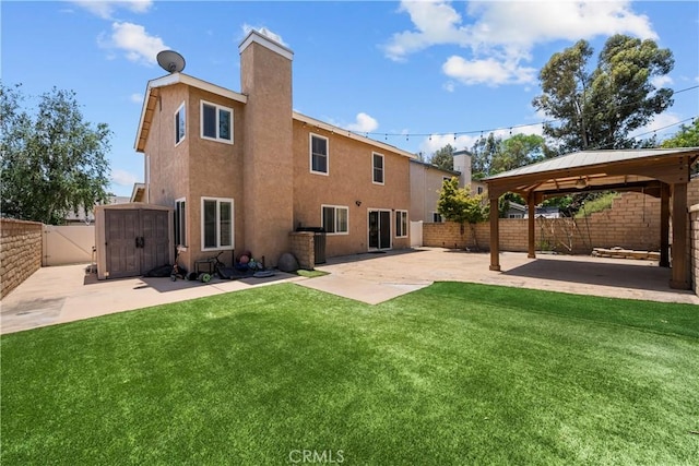 21643 Masterson Ct, Saugus, CA 91350 - rear view of house featuring a gazebo, a fenced backyard, a patio, a storage unit, and a chimney