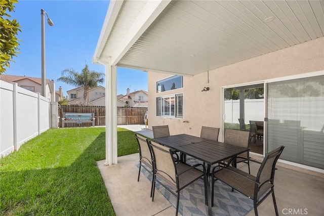 870 Clover Ln, Corona, CA 92878 - fenced backyard with a patio, outdoor dining space, a jacuzzi, and a residential view
