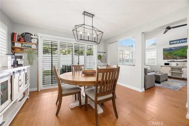 870 Clover Ln, Corona, CA 92878 - dining area with a chandelier, light wood finished floors, and ceiling fan