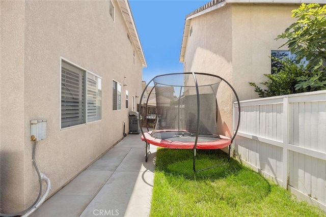 870 Clover Ln, Corona, CA 92878 - view of yard featuring a trampoline