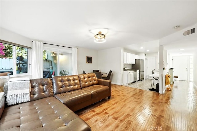 1739 E Broadway Unit 6, Long Beach, CA 90802 - living area with light wood-style floors and recessed lighting