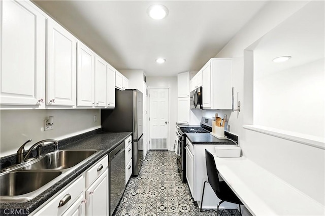 1739 E Broadway Unit 6, Long Beach, CA 90802 - kitchen with appliances with stainless steel finishes, white cabinetry, dark countertops, and recessed lighting