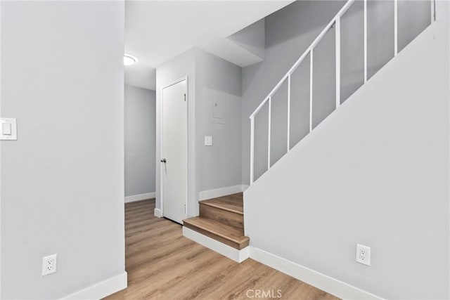 1745 Neil Armstrong St Unit 206, Montebello, CA 90640 - stairway with baseboards and wood finished floors