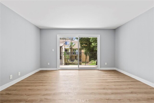 1745 Neil Armstrong St Unit 206, Montebello, CA 90640 - empty room with wood finished floors and baseboards