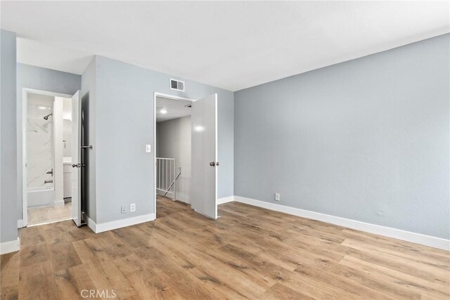 1745 Neil Armstrong St Unit 206, Montebello, CA 90640 - empty room with light wood-type flooring and baseboards