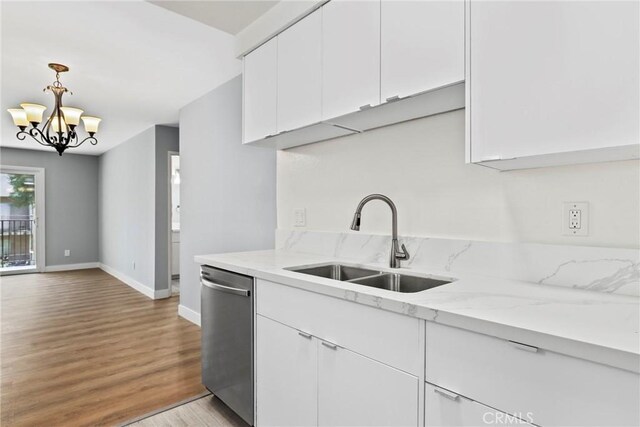 1745 Neil Armstrong St Unit 206, Montebello, CA 90640 - kitchen featuring dishwasher, white cabinetry, light wood finished floors, a chandelier, and light stone countertops