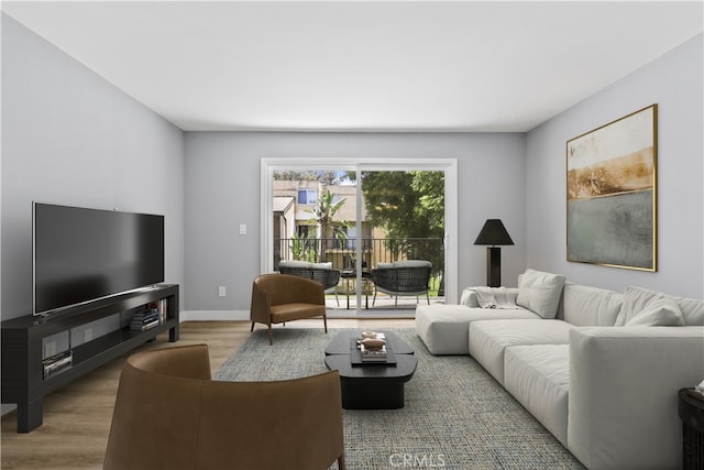 1745 Neil Armstrong St Unit 206, Montebello, CA 90640 - living room with wood finished floors and baseboards