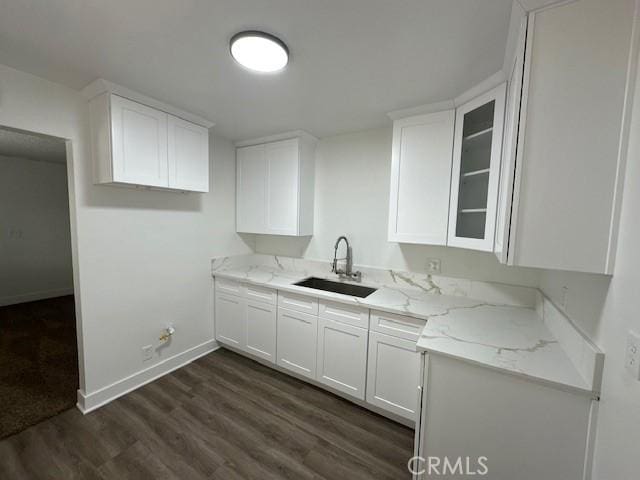 211-215 E California Ave, Ridgecrest, CA 93555 - kitchen with dark wood finished floors, white cabinetry, and light stone countertops
