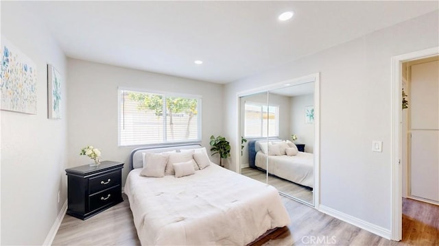 8007 New Salem St, San Diego, CA 92126 - bedroom featuring light wood-style floors, a closet, and recessed lighting