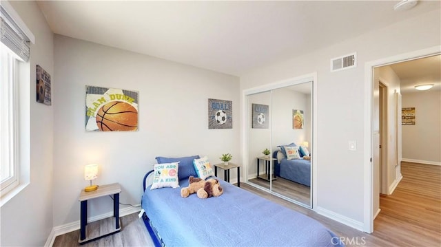 8007 New Salem St, San Diego, CA 92126 - bedroom featuring wood finished floors and a closet