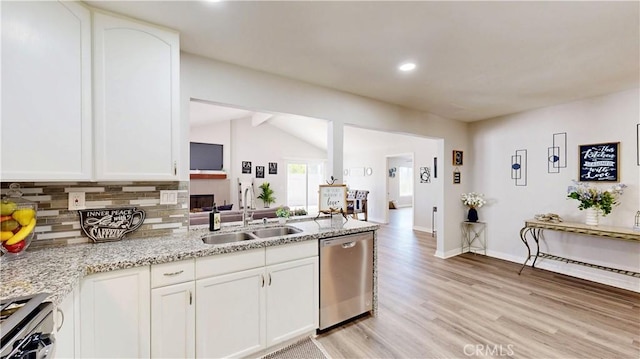 8007 New Salem St, San Diego, CA 92126 - kitchen featuring stainless steel appliances, backsplash, light wood finished floors, white cabinets, and vaulted ceiling