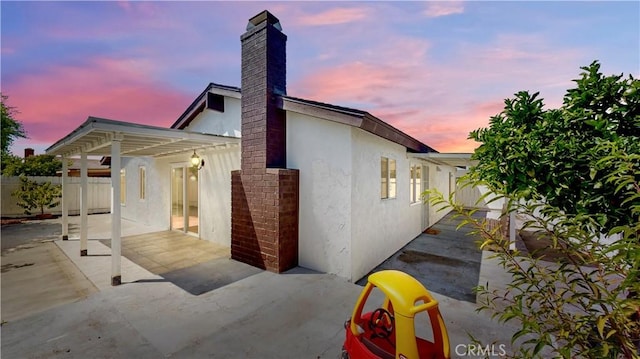 8007 New Salem St, San Diego, CA 92126 - back of property featuring a patio, stucco siding, and a chimney
