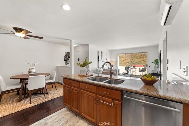 21981 Rimhurst Dr Unit 158, Lake Forest, CA 92630 - kitchen with dishwasher, open floor plan, a wall mounted air conditioner, brown cabinets, and dark stone counters