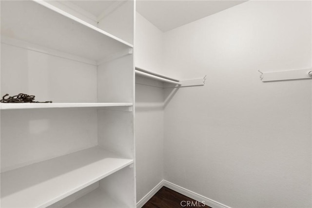 21981 Rimhurst Dr Unit 158, Lake Forest, CA 92630 - walk in closet featuring dark wood-type flooring