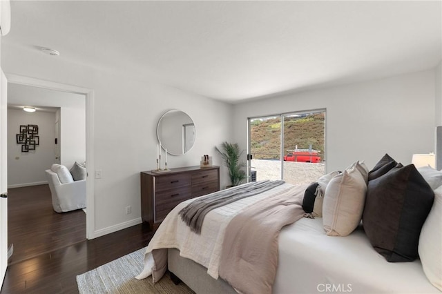 21981 Rimhurst Dr Unit 158, Lake Forest, CA 92630 - bedroom with access to exterior and wood finished floors