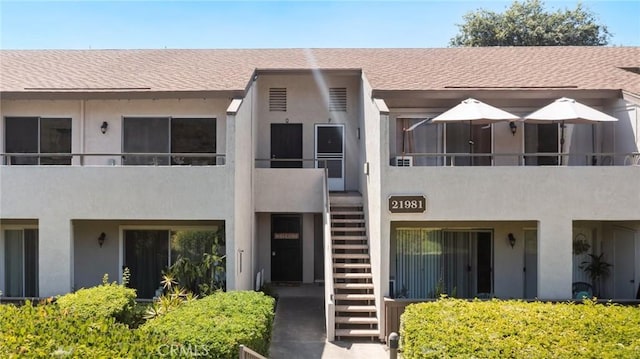21981 Rimhurst Dr Unit 158, Lake Forest, CA 92630 - view of building exterior with stairs