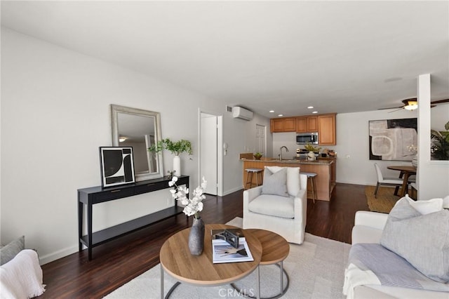 21981 Rimhurst Dr Unit 158, Lake Forest, CA 92630 - living room featuring dark wood-style flooring, ceiling fan, a wall unit AC, and recessed lighting