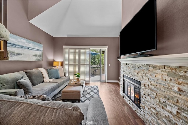 23957 Arroyo Park Dr Unit 146, Valencia, CA 91355 - living area with wood finished floors, a fireplace, and vaulted ceiling