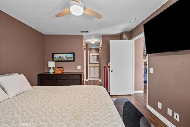 23957 Arroyo Park Dr Unit 146, Valencia, CA 91355 - bedroom with wood finished floors, ceiling fan, and ensuite bathroom