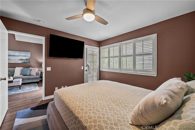 23957 Arroyo Park Dr Unit 146, Valencia, CA 91355 - bedroom featuring dark wood-style flooring and ceiling fan