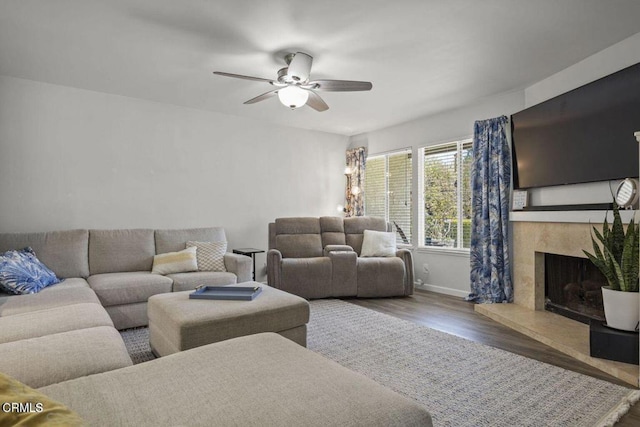 3151 W Hemlock St, Oxnard, CA 93035 - living area with wood finished floors, a high end fireplace, and a ceiling fan